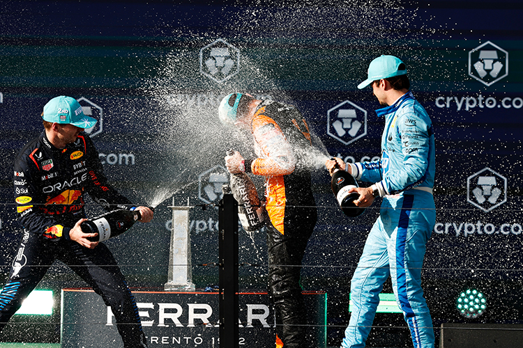 Lando Norris, Max Verstappen, and Charles Leclerc celebrate on the podium after the Miami GP at Miami International Autodrome, May 5, 2024.