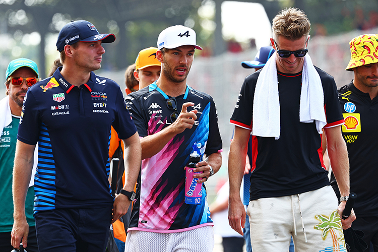 Max Verstappen, Pierre Gasly, and Nico Hulkenberg walk together during the drivers' parade before the Italian GP at Autodromo Nazionale Monza, September 1, 2024.