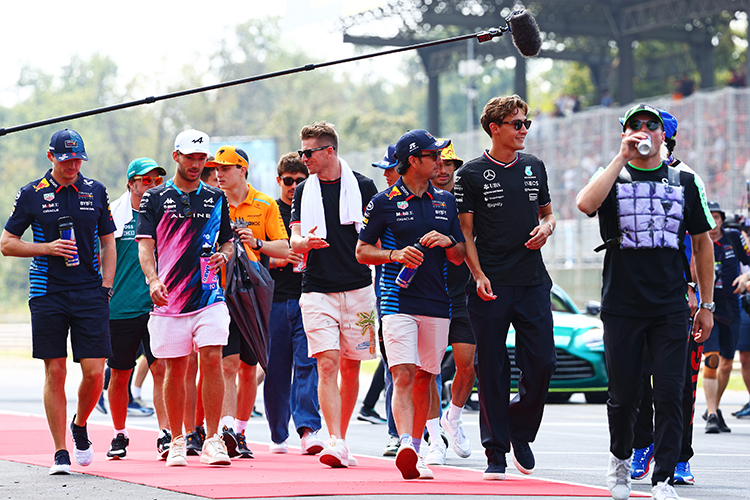 Sergio Perez and George Russell chat during the drivers' parade before the Italian GP at Autodromo Nazionale Monza, September 1, 2024.