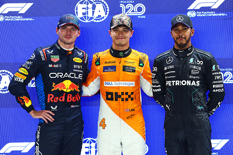 Lando Norris, Max Verstappen, and Lewis Hamilton pose in parc ferme after qualifying for the Singapore GP at Marina Bay Street Circuit, September 21, 2024.