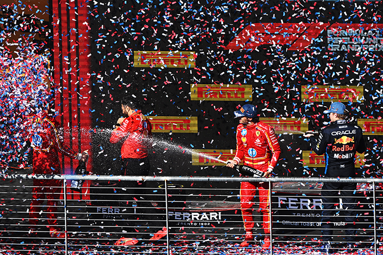 Charles Leclerc, Carlos Sainz, and Max Verstappen celebrate on the podium after the United States GP at Circuit of The Americas, October 20, 2024.